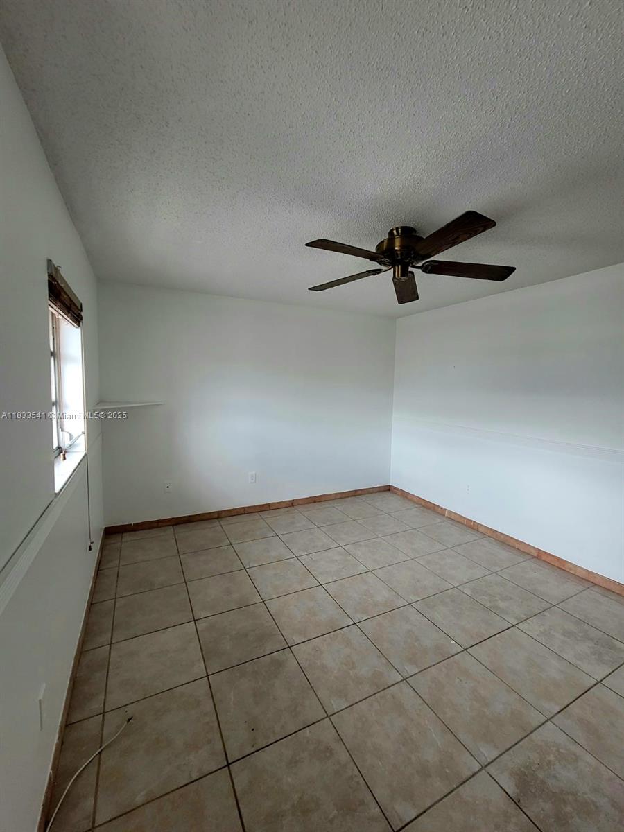 11 Olive Drive, Unit J Hialeah, FL 33010 - Photo 9 of 20 a view of a livingroom and a window