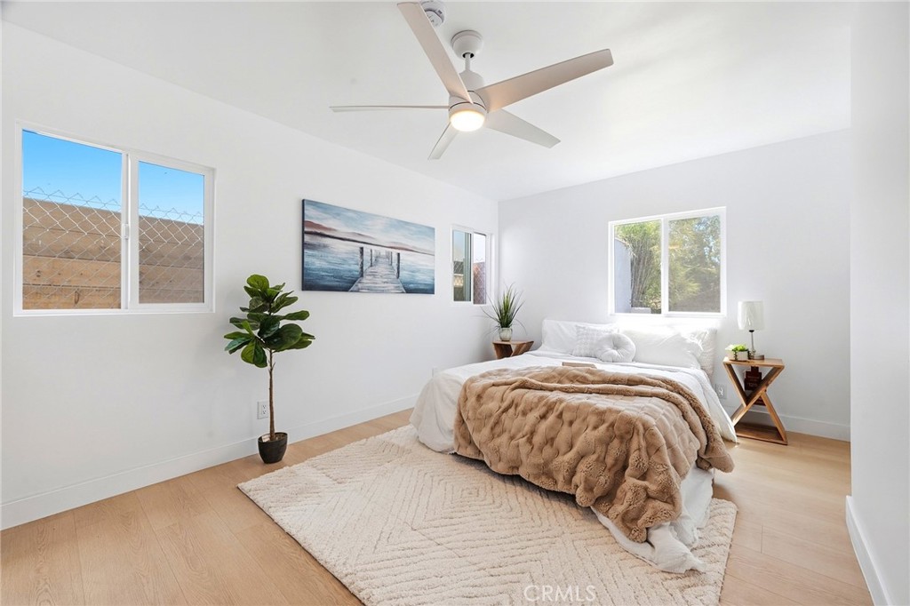 1280 East Woodbury Road Pasadena, CA 91104 - Photo 26 of 40 a bedroom with a bed and a potted plant