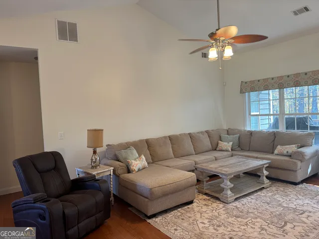 a view of a living room and a couch in a room