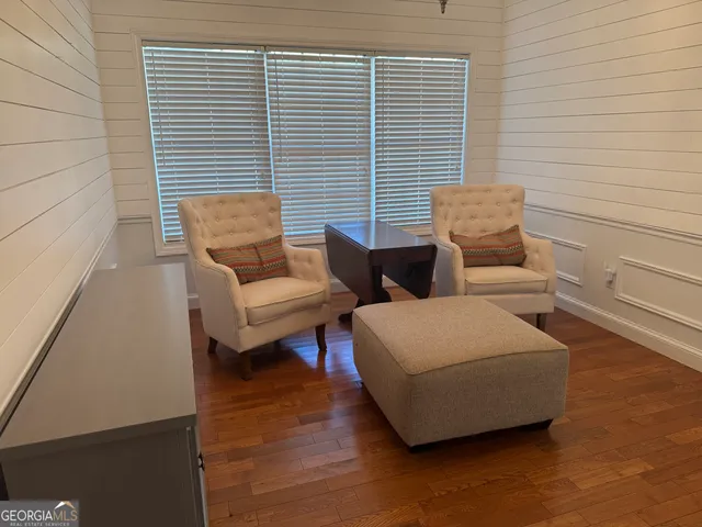 a view of living room with furniture and window
