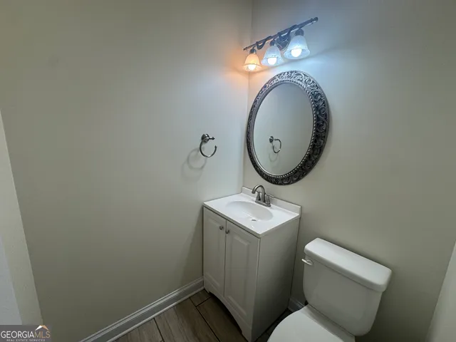a view of a hallway with the wooden floor