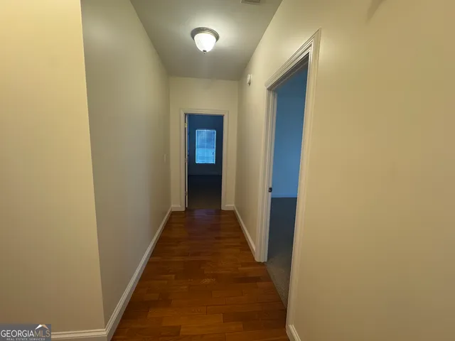 a bedroom with a bed and a desk