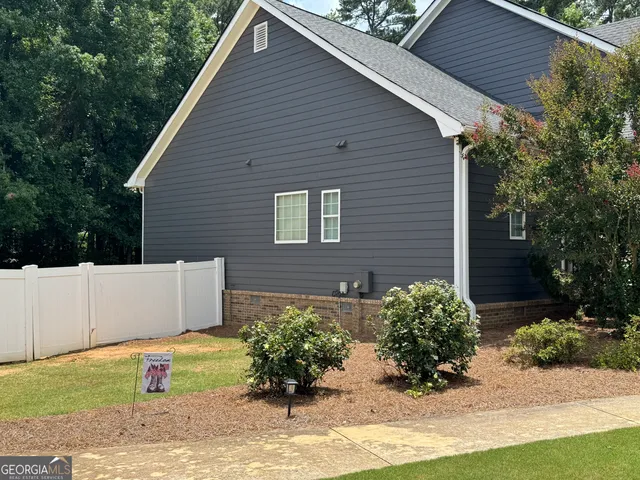 a view of a backyard with plants