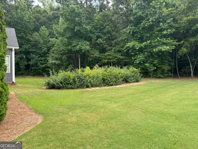 a view of a golf course with a garden