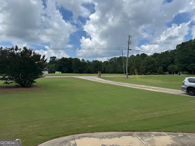 a view of a golf course with a lake