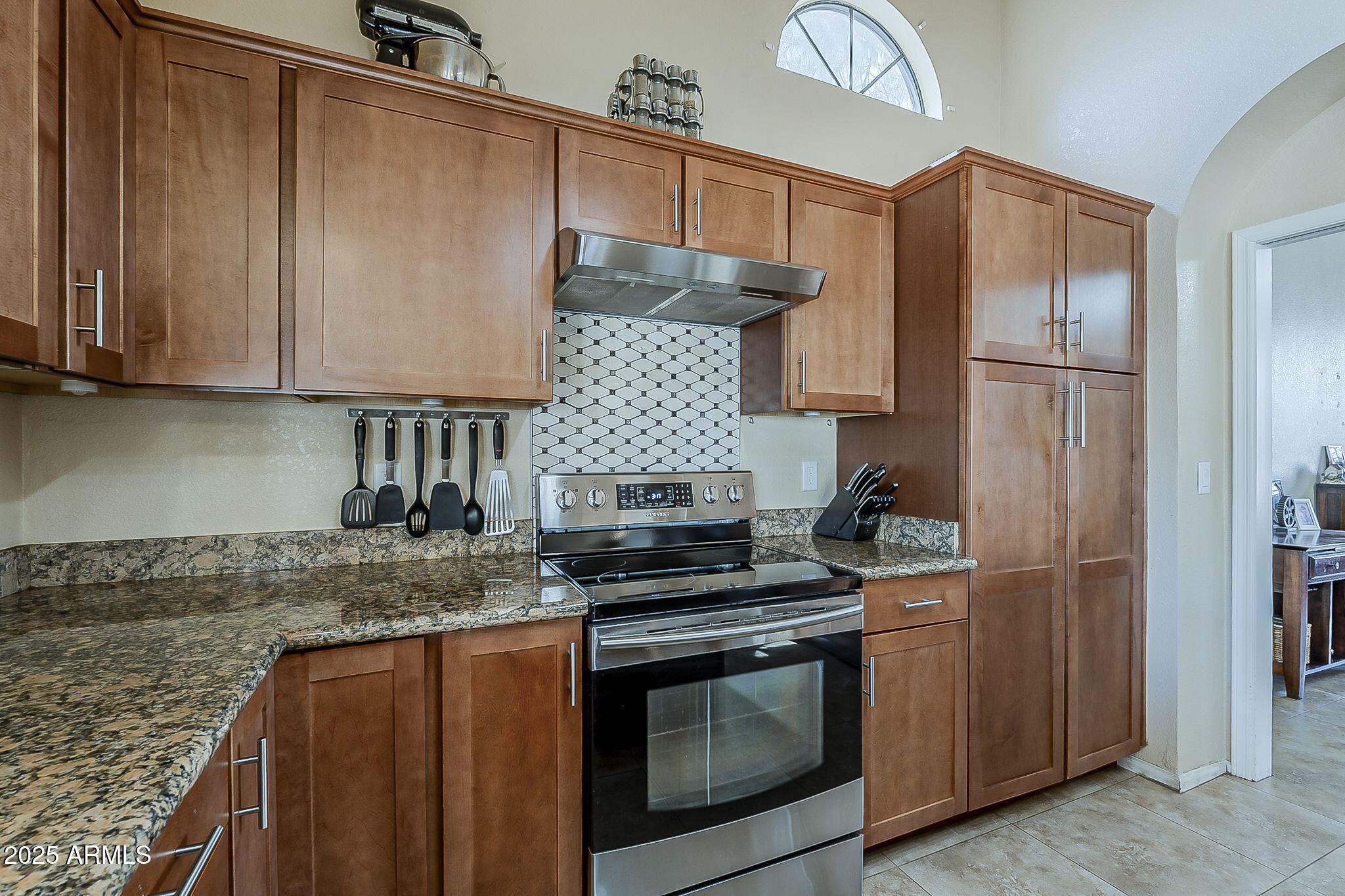 1927 East Ranch Road Tempe, AZ 85284 - Photo 13 of 64 a kitchen with granite countertop a stove sink and refrigerator