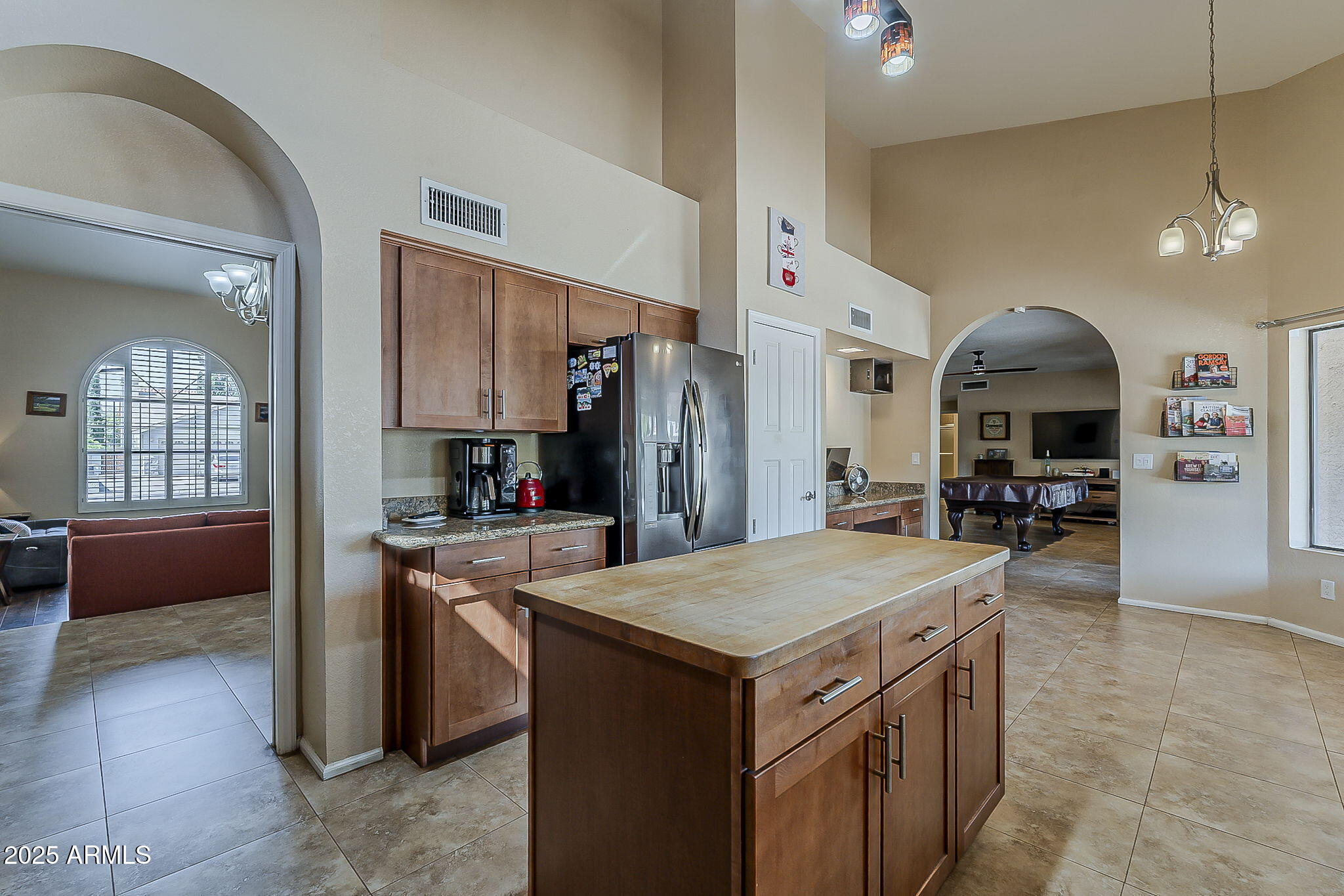 1927 East Ranch Road Tempe, AZ 85284 - Photo 14 of 64 a kitchen with a stove a refrigerator and a sink
