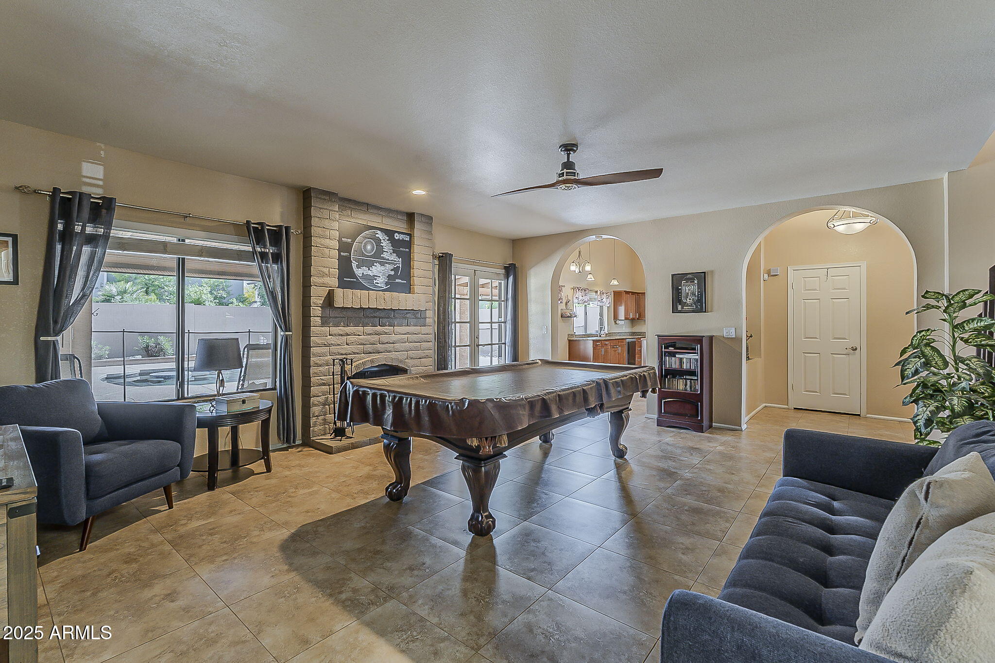 1927 East Ranch Road Tempe, AZ 85284 - Photo 17 of 64 a living room with furniture a table and a large window