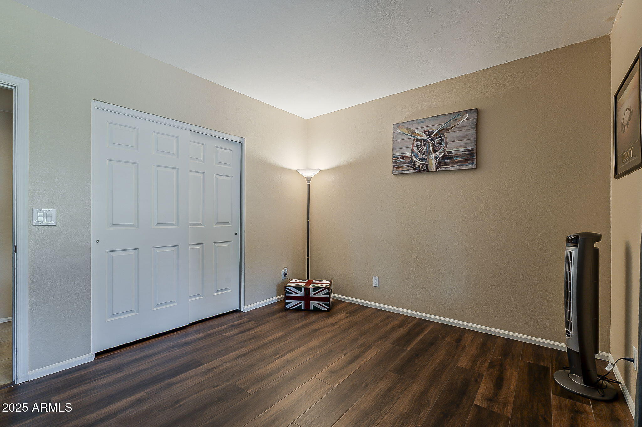 1927 East Ranch Road Tempe, AZ 85284 - Photo 22 of 64 a view of a room with wooden floor and white walls
