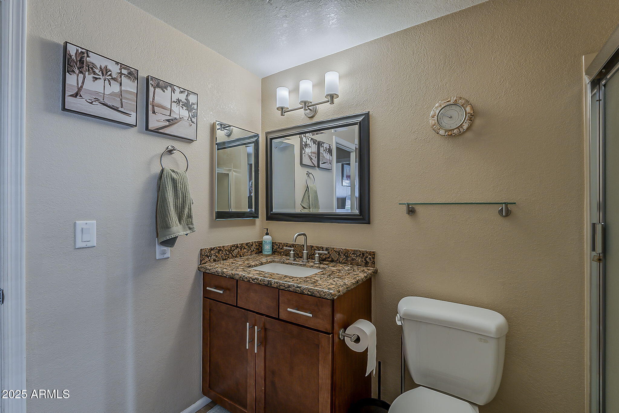 1927 East Ranch Road Tempe, AZ 85284 - Photo 24 of 64 a bathroom with a toilet sink and mirror