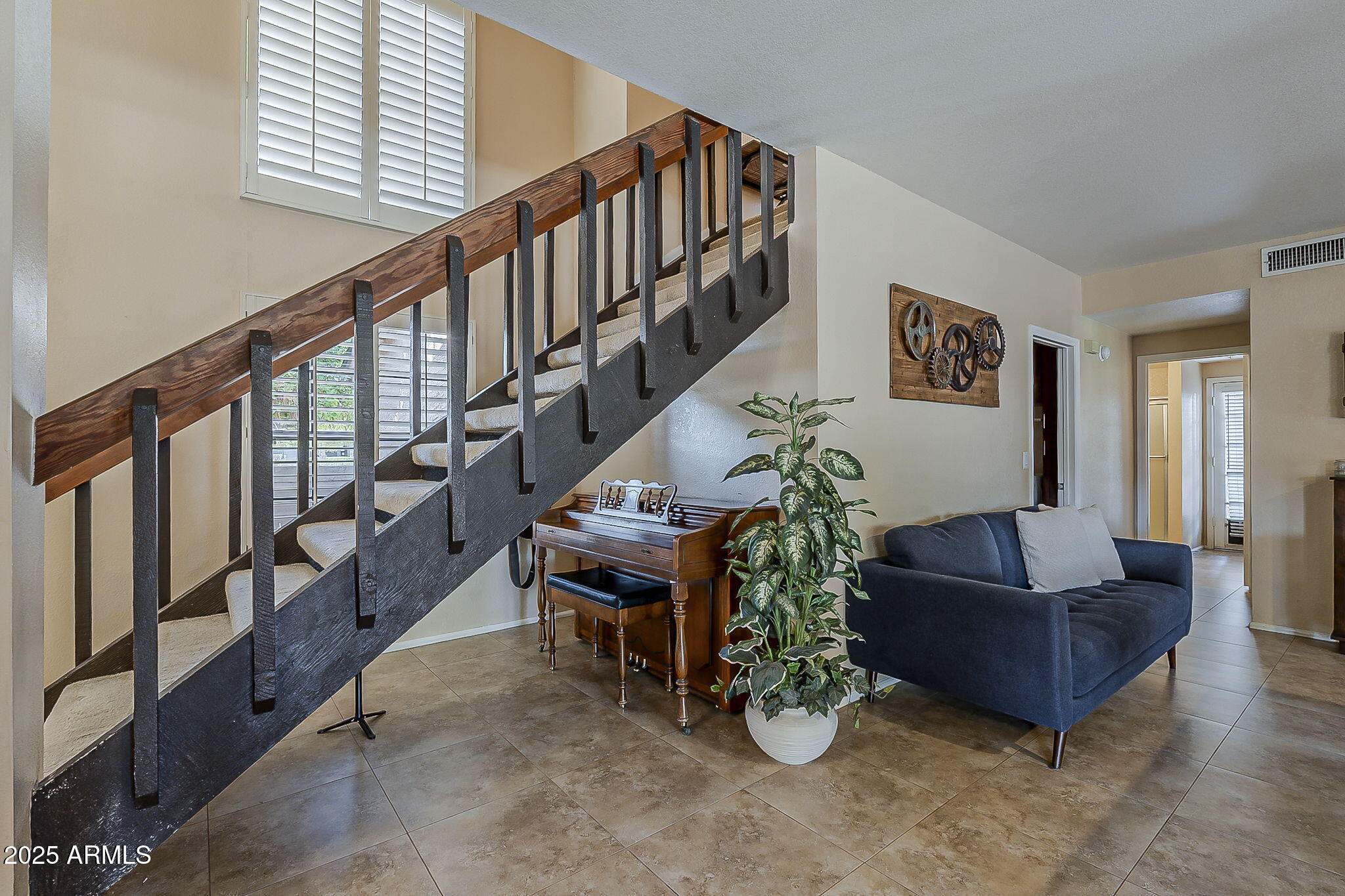 1927 East Ranch Road Tempe, AZ 85284 - Photo 27 of 64 a living room with furniture and stairs