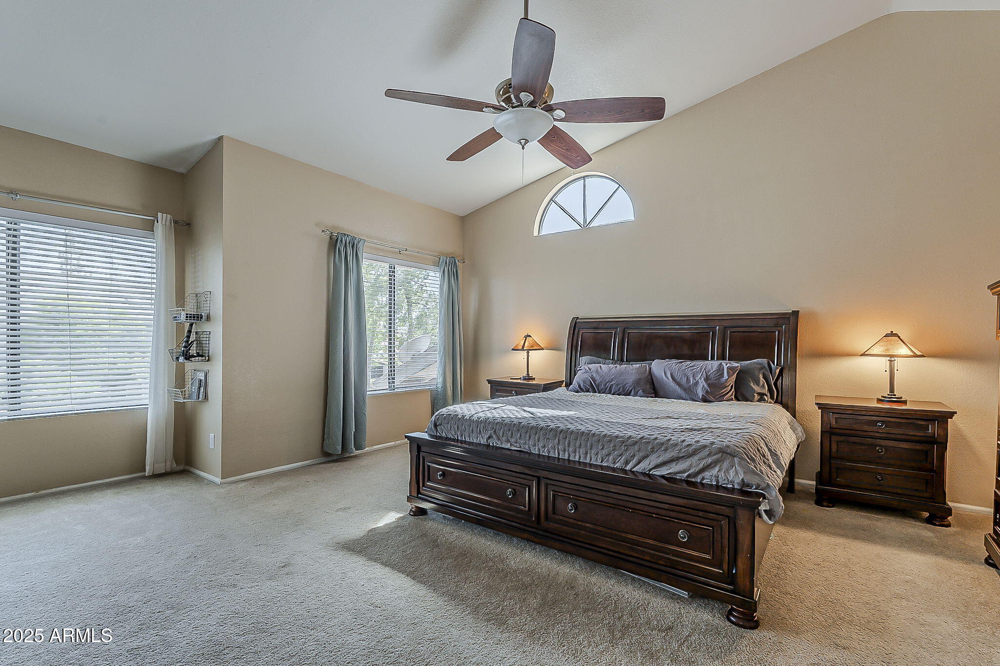 1927 East Ranch Road Tempe, AZ 85284 - Photo 29 of 64 a spacious bedroom with a bed and a chandelier