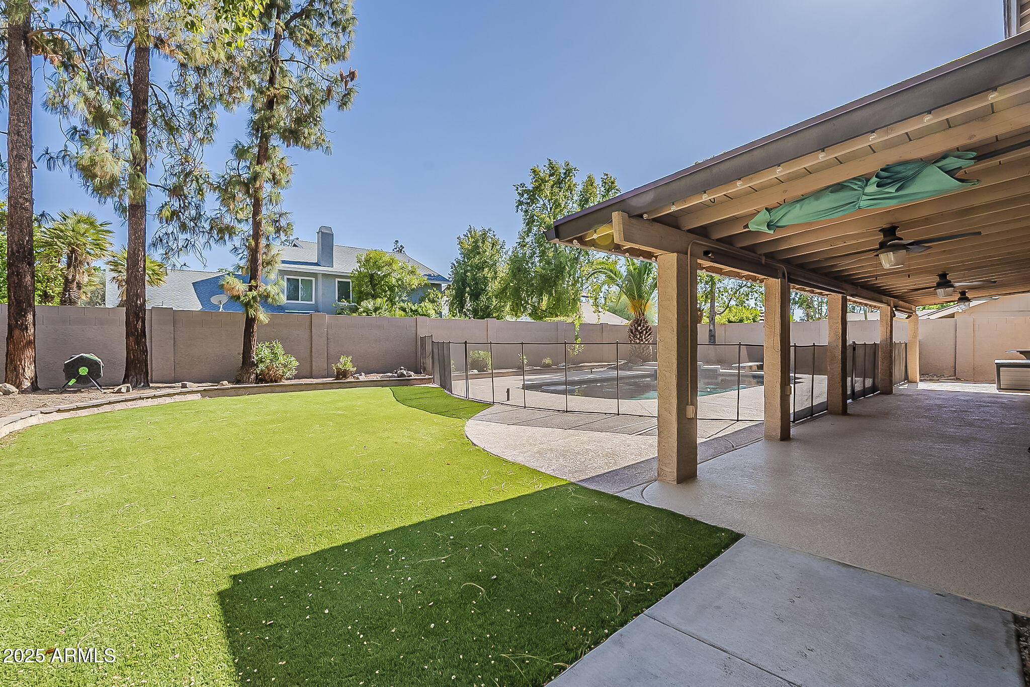 1927 East Ranch Road Tempe, AZ 85284 - Photo 47 of 64 a swimming pool with outdoor seating and yard