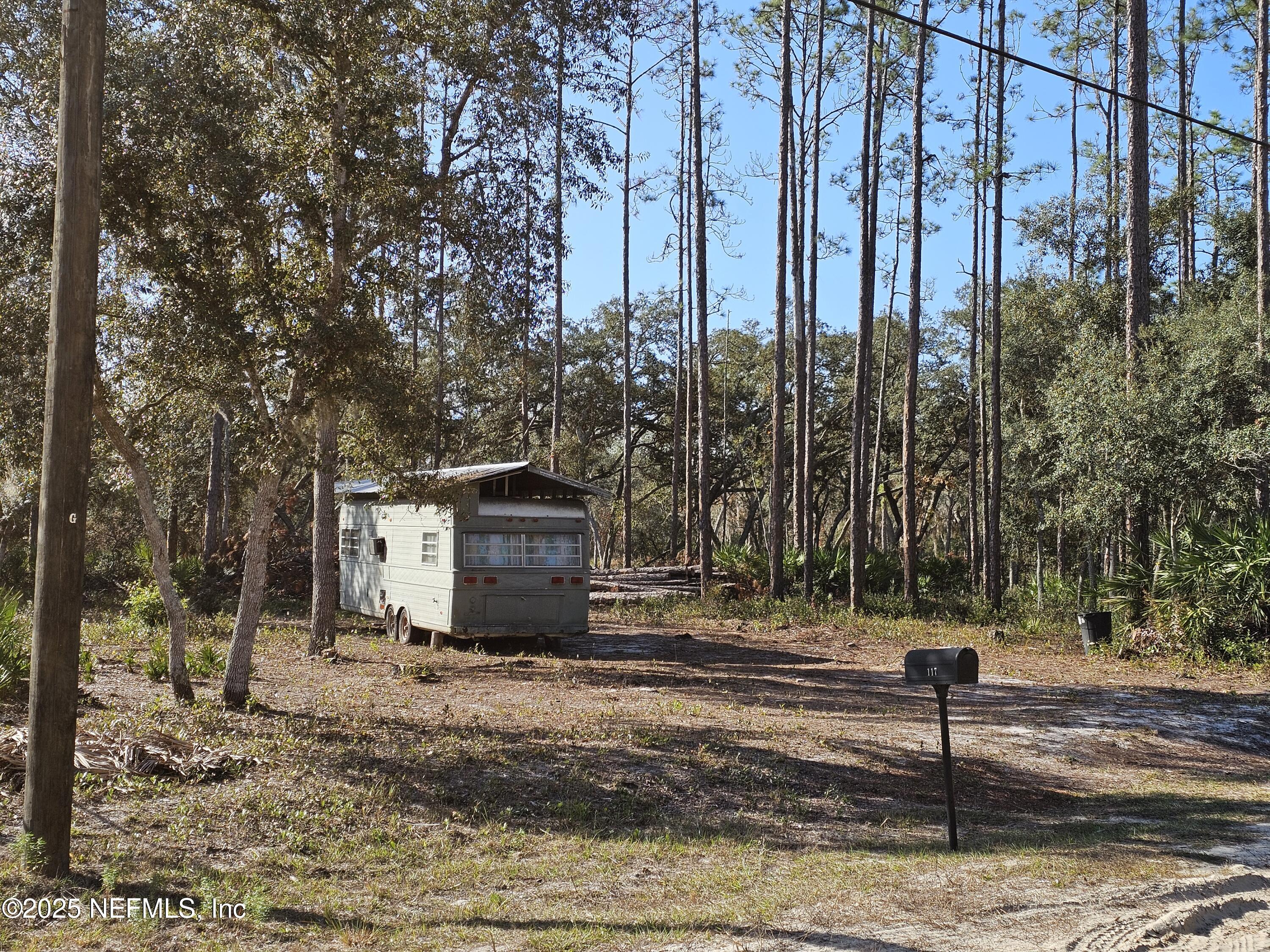 117 Glisson Street Interlachen, FL 32148 - Photo 3 of 20 a view of a street with a building