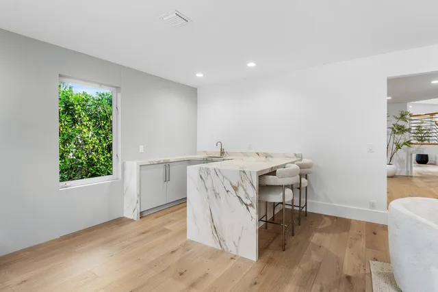 a kitchen with a sink and a washer dryer