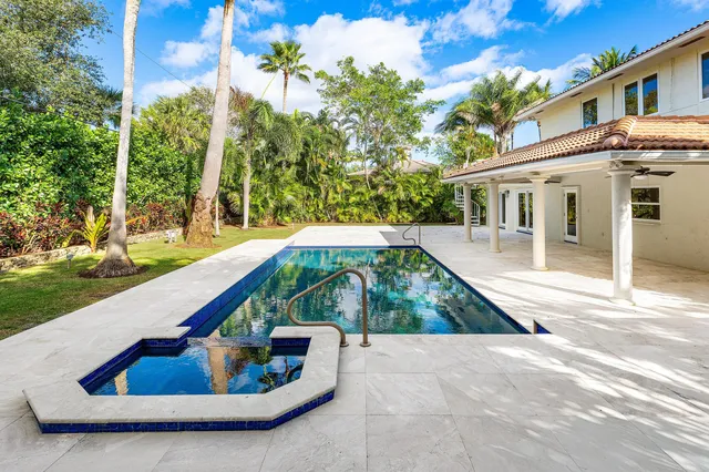 a view of swimming pool with lounge chair