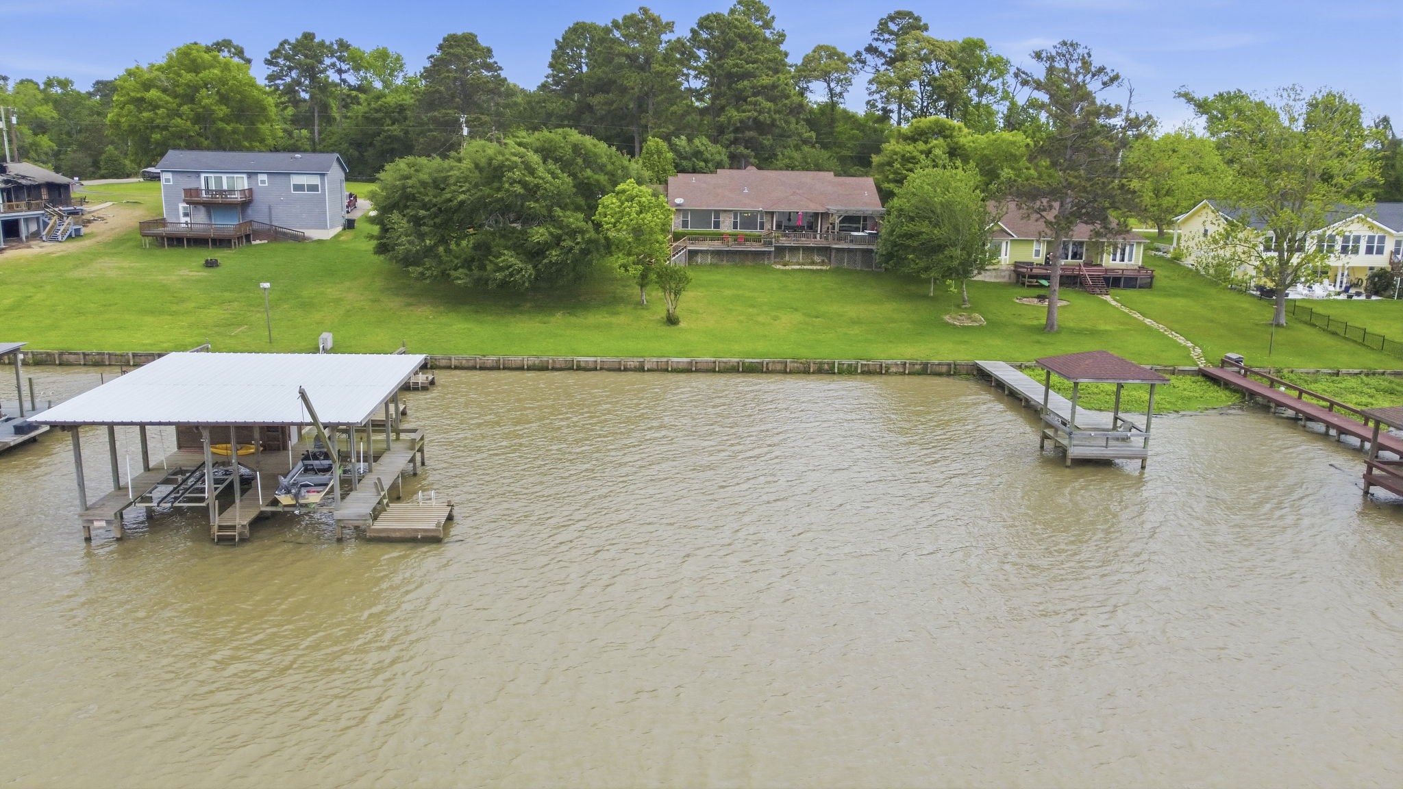 259 Memphis Bell Lane Trinity, TX 75862 - Photo 41 of 50 an aerial view of a house with a yard and lake view