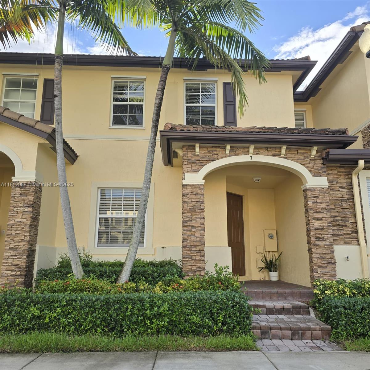 9051 Southwest 227th Street, Unit 3 Cutler Bay, FL 33190 - Photo 1 of 33 a front view of a house