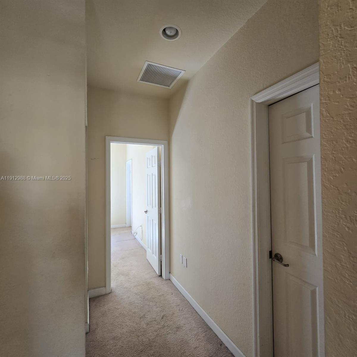 9051 Southwest 227th Street, Unit 3 Cutler Bay, FL 33190 - Photo 19 of 33 a view of a hallway with a room