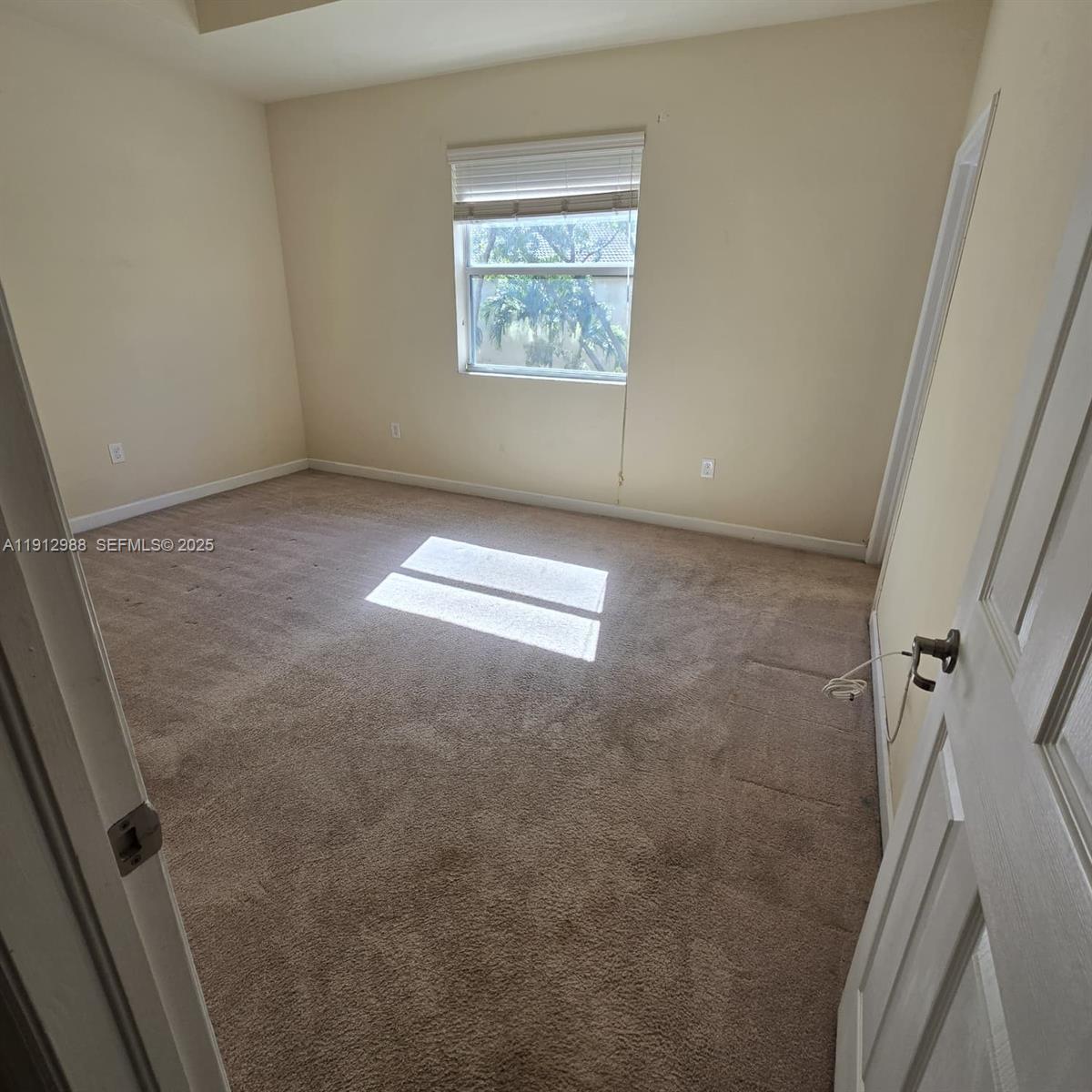 9051 Southwest 227th Street, Unit 3 Cutler Bay, FL 33190 - Photo 24 of 33 a view of room with window