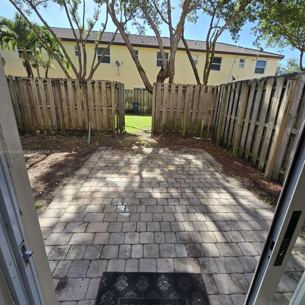 9051 Southwest 227th Street, Unit 3 Cutler Bay, FL 33190 - Photo 27 of 33 a view of entrance gate of a house