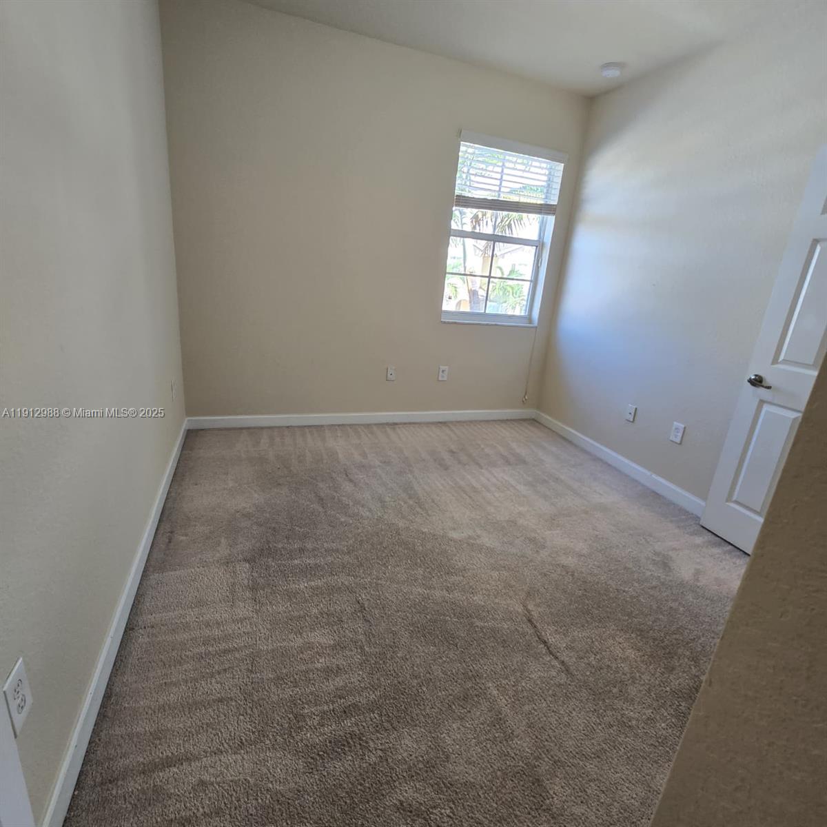 9051 Southwest 227th Street, Unit 3 Cutler Bay, FL 33190 - Photo 31 of 33 an empty room with windows