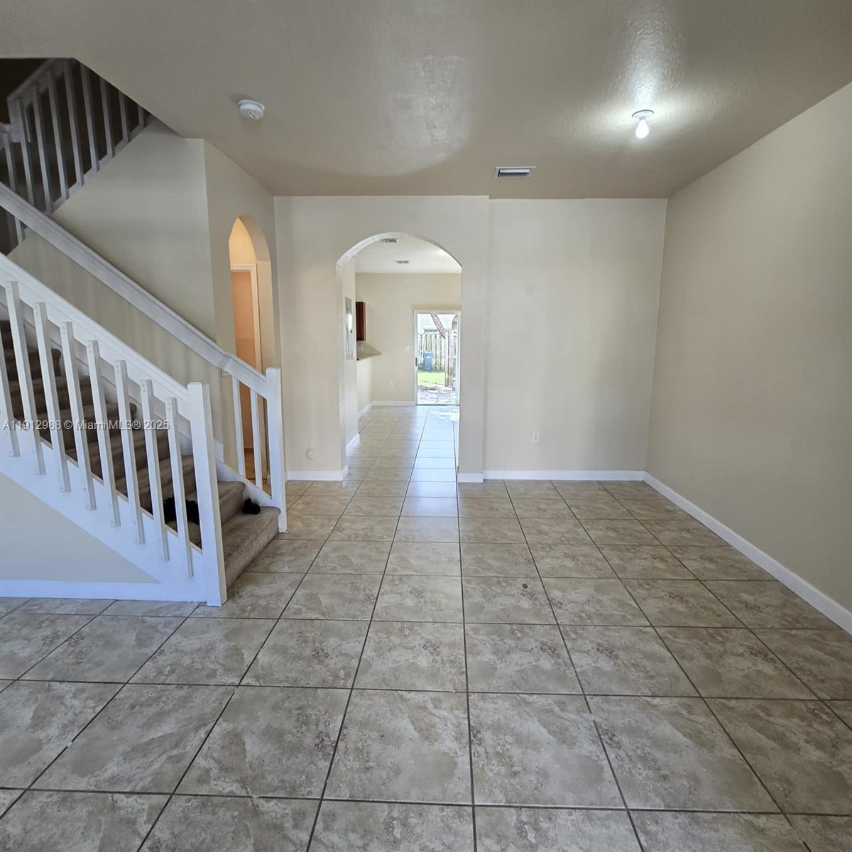 9051 Southwest 227th Street, Unit 3 Cutler Bay, FL 33190 - Photo 5 of 33 a view of a hallway with staircase