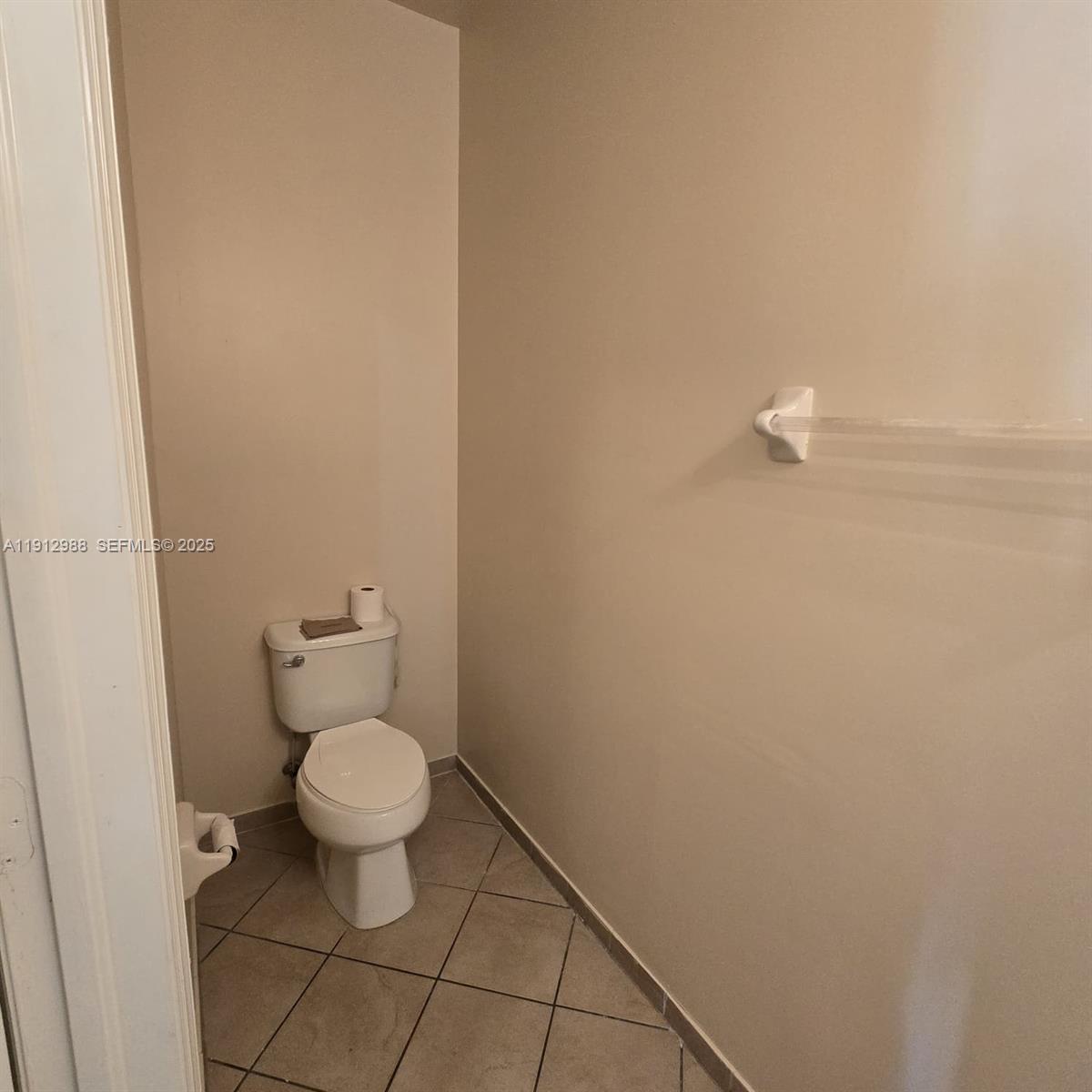 9051 Southwest 227th Street, Unit 3 Cutler Bay, FL 33190 - Photo 7 of 33 a bathroom with a toilet