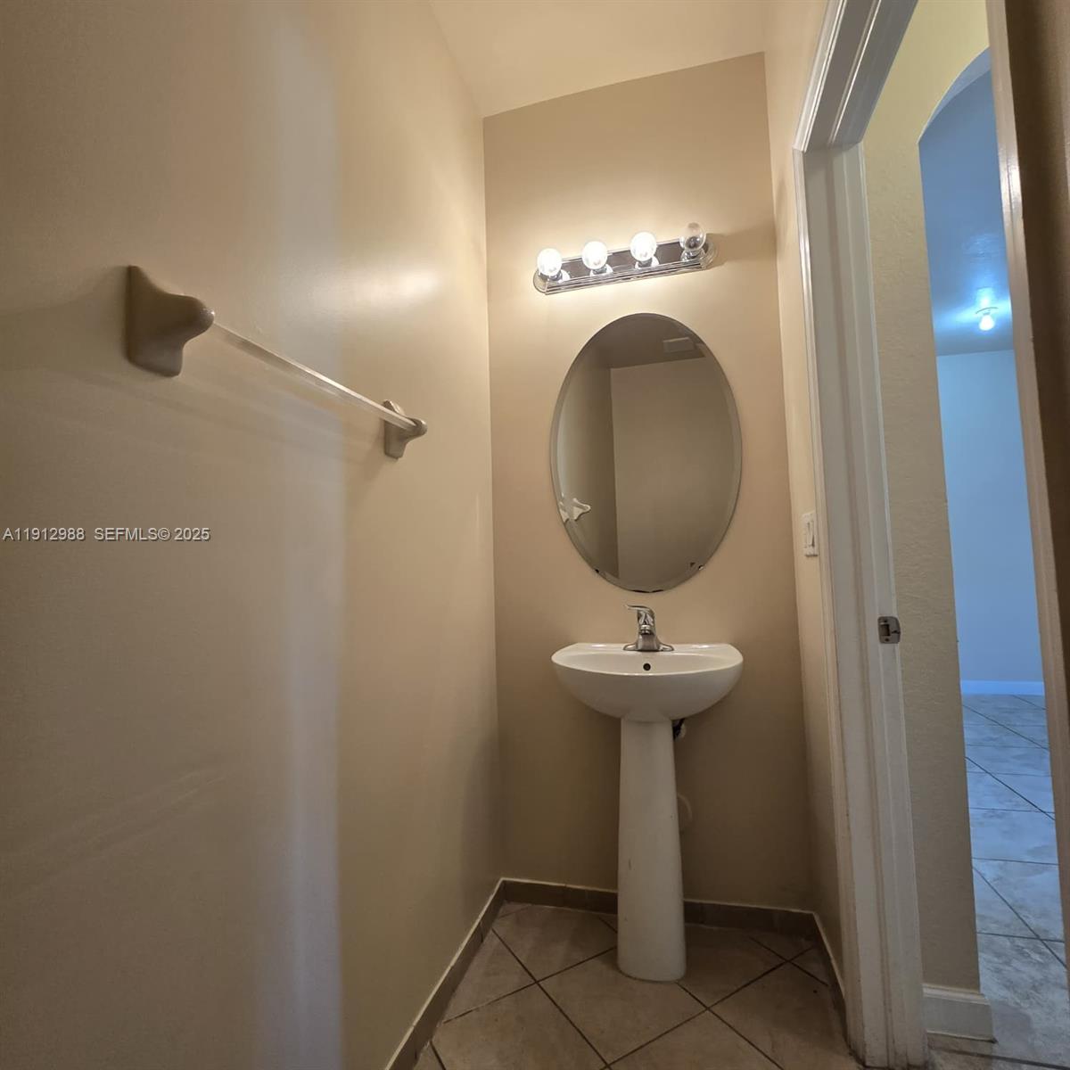9051 Southwest 227th Street, Unit 3 Cutler Bay, FL 33190 - Photo 8 of 33 a bathroom with a sink and toilet