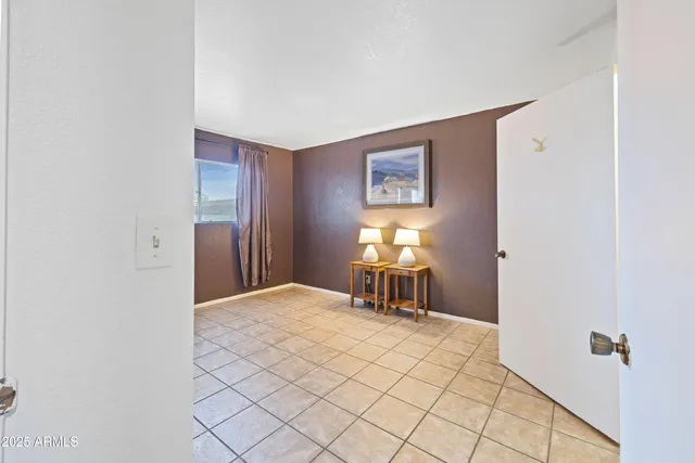 a view of a room with wooden floor and chair