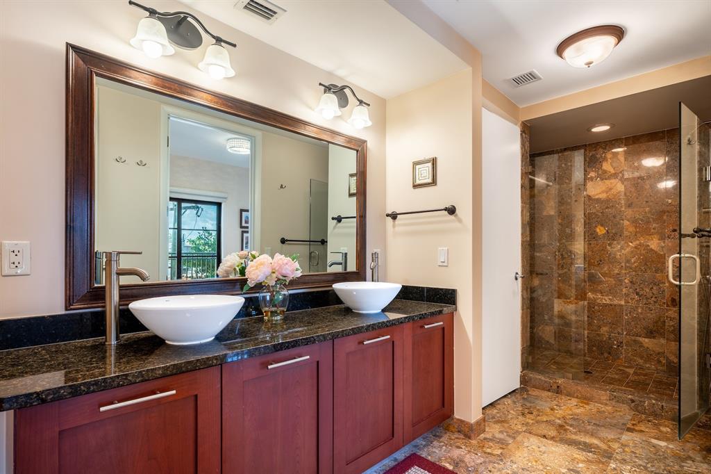 2401 North Ocean Boulevard, Unit 403 Fort Lauderdale, FL 33305 - Photo 19 of 32 a bathroom with a granite countertop sink and a mirror