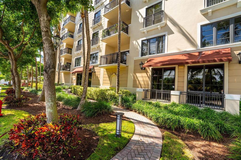 2401 North Ocean Boulevard, Unit 403 Fort Lauderdale, FL 33305 - Photo 23 of 32 a front view of a building with a garden