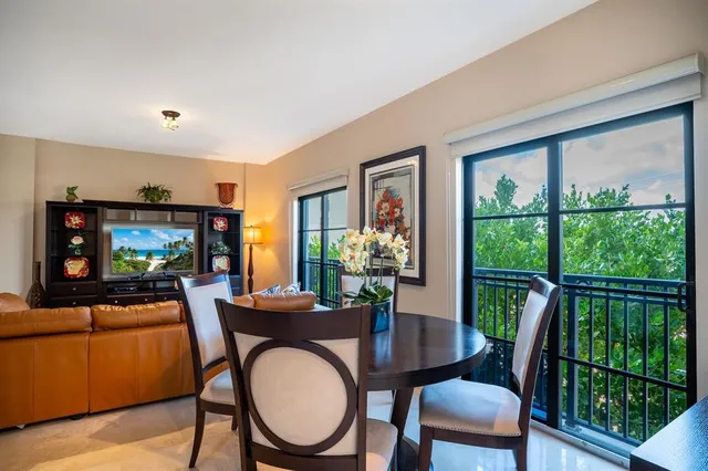 a view of a dining room with furniture window and outside view