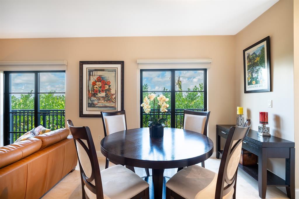 2401 North Ocean Boulevard, Unit 403 Fort Lauderdale, FL 33305 - Photo 7 of 32 a view of a dining room with furniture window and outside view
