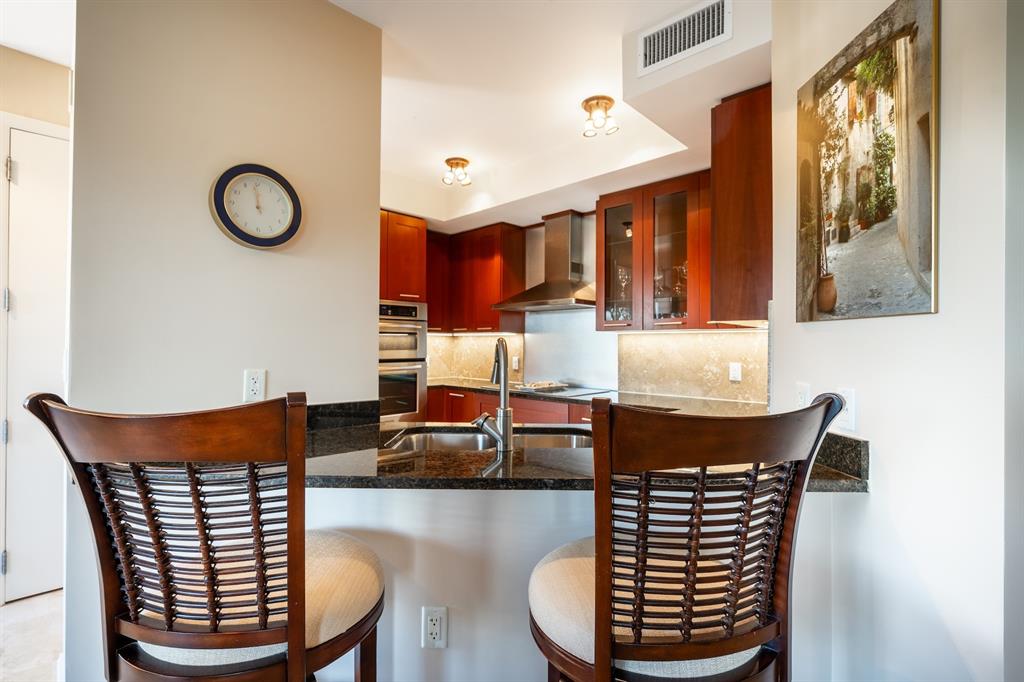 2401 North Ocean Boulevard, Unit 403 Fort Lauderdale, FL 33305 - Photo 10 of 32 a view of dinning table and chairs in a room
