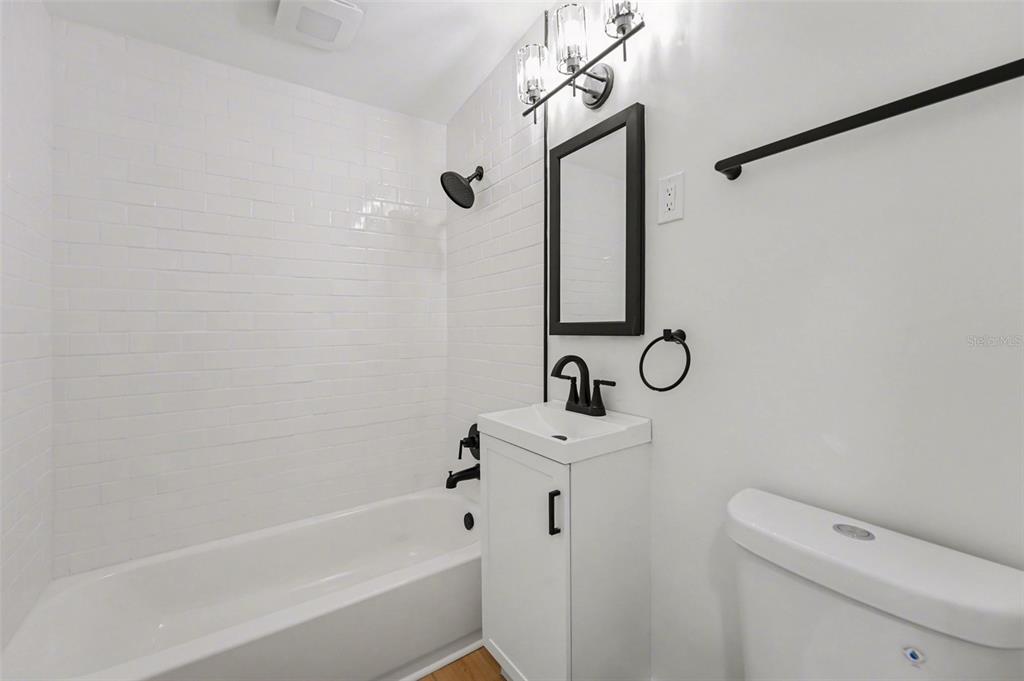 9482 Crestview Street Seminole, FL 33772 - Photo 25 of 35 a bathroom with a sink a toilet and shower