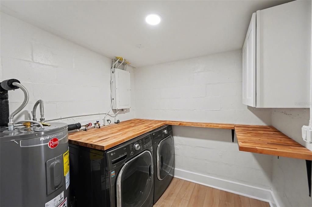 9482 Crestview Street Seminole, FL 33772 - Photo 26 of 35 a utility room with dryer and washer