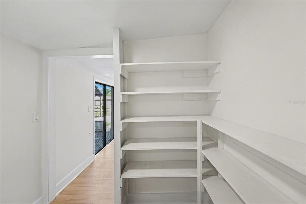 9482 Crestview Street Seminole, FL 33772 - Photo 27 of 35 a view of an empty walk in closet