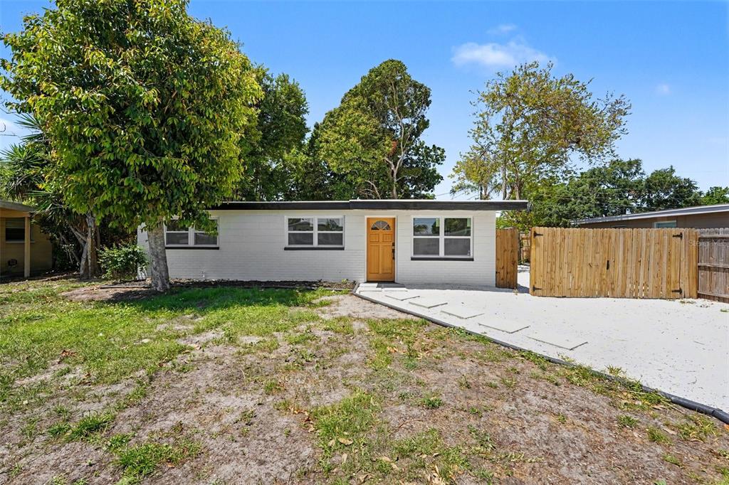 9482 Crestview Street Seminole, FL 33772 - Photo 4 of 35 front view of house with a yard
