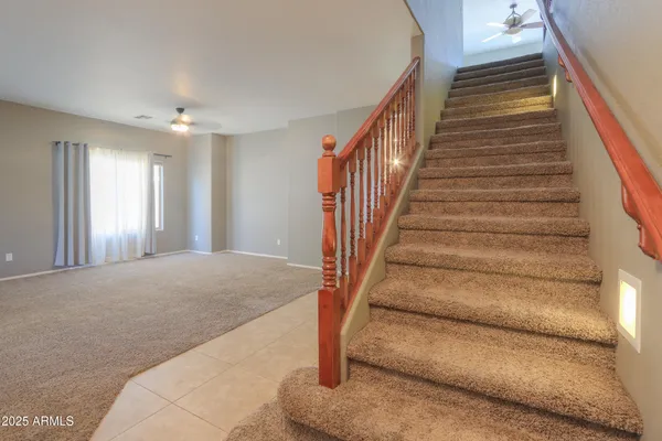 a large kitchen with kitchen island granite countertop a large counter top and stainless steel appliances