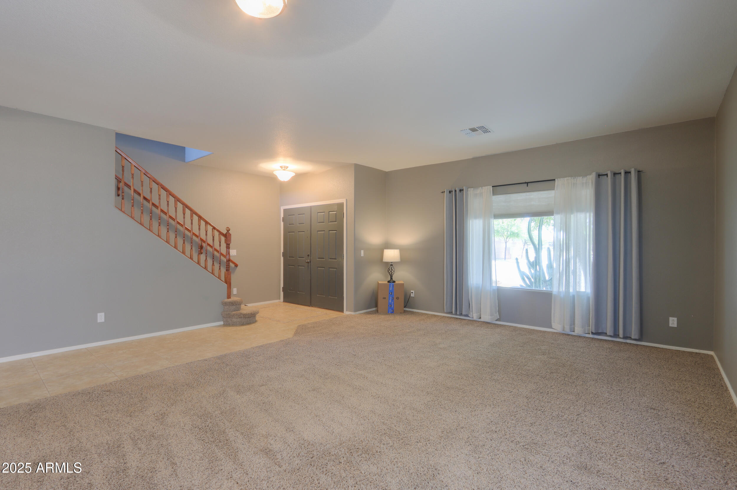 44254 Adobe Circle Maricopa, AZ 85139 - Photo 14 of 71 a view of a livingroom with a staircase