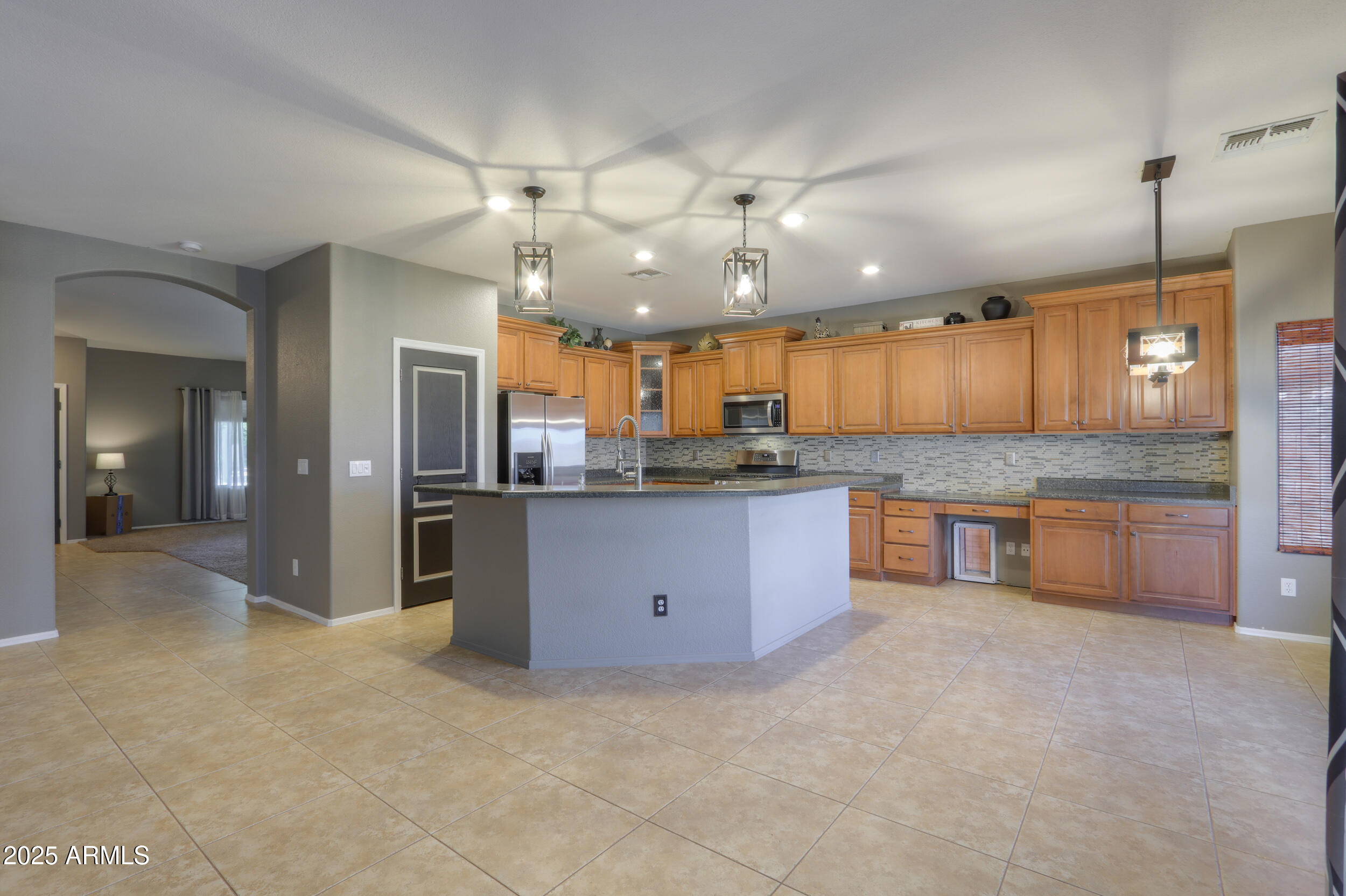 44254 Adobe Circle Maricopa, AZ 85139 - Photo 17 of 71 a large kitchen with a large counter top cabinets and appliances