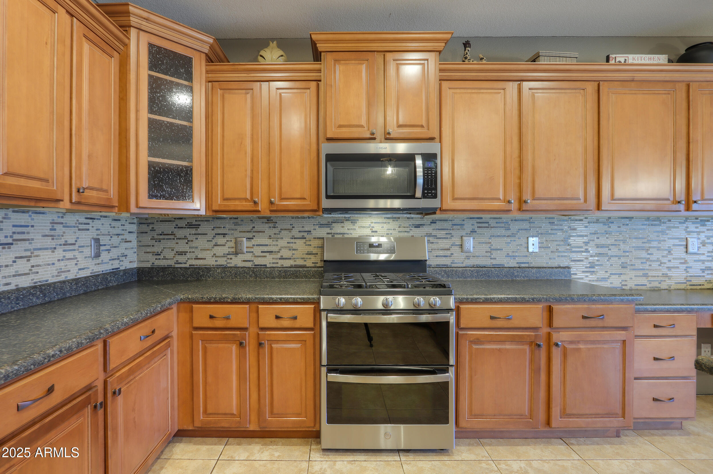 44254 Adobe Circle Maricopa, AZ 85139 - Photo 22 of 71 a kitchen with granite countertop a sink and a stove