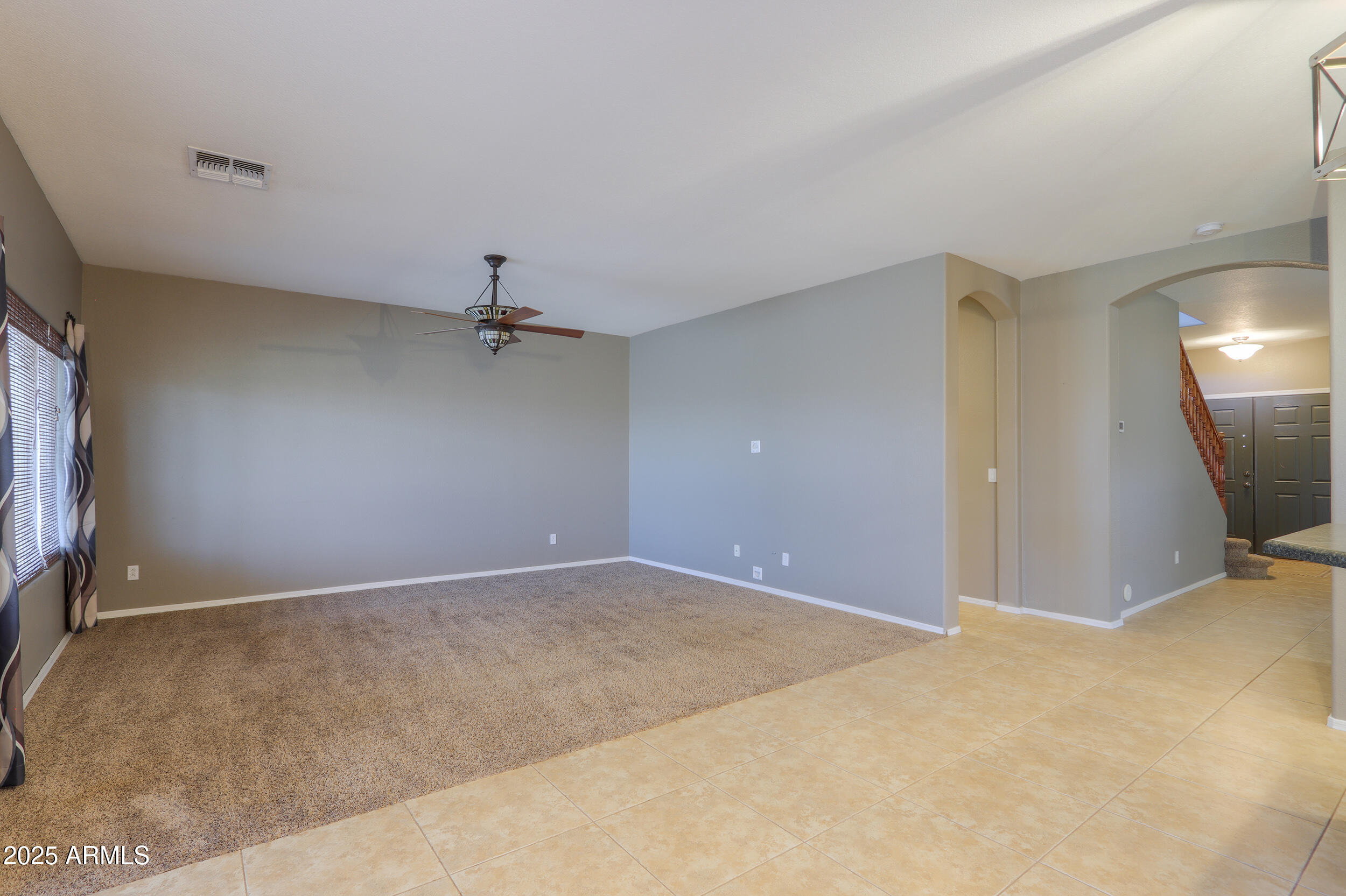 44254 Adobe Circle Maricopa, AZ 85139 - Photo 24 of 71 an empty room with a ceiling fan and window