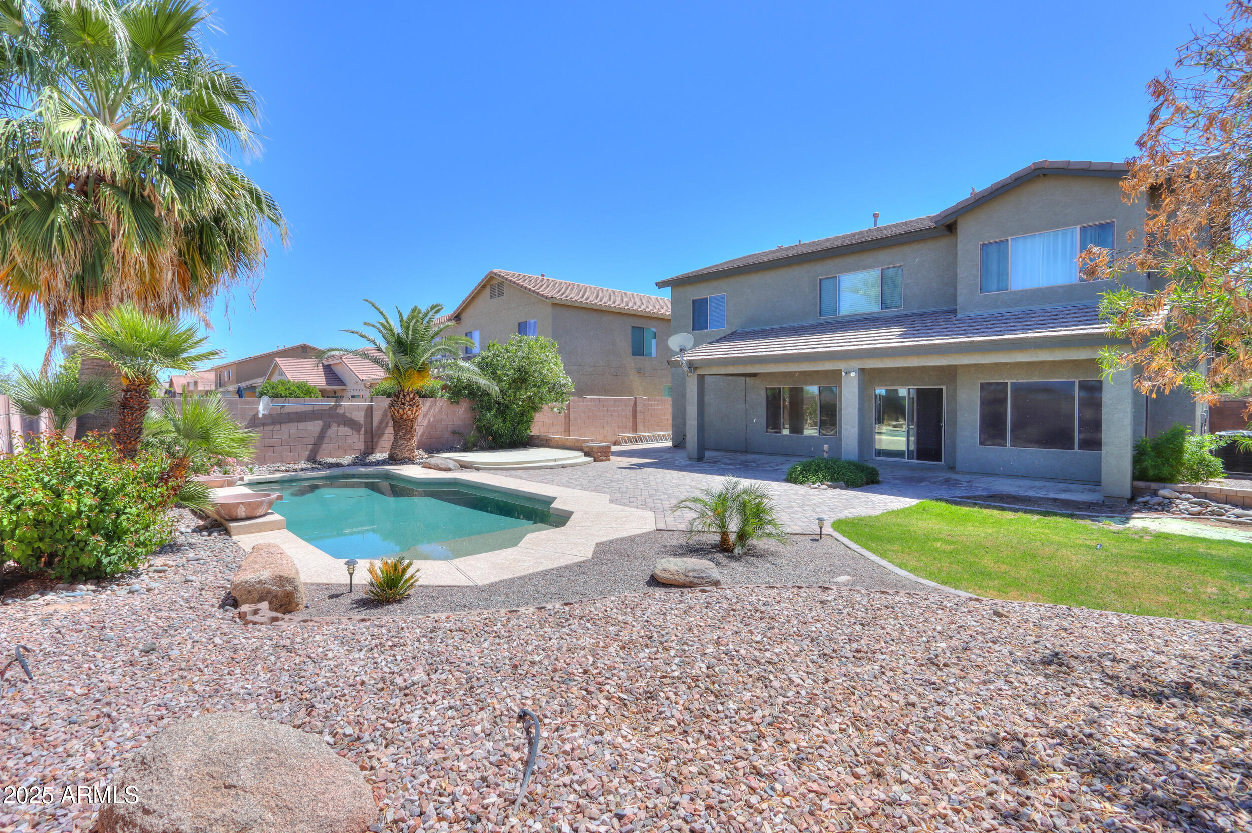 44254 Adobe Circle Maricopa, AZ 85139 - Photo 3 of 71 a front view of a house with a yard