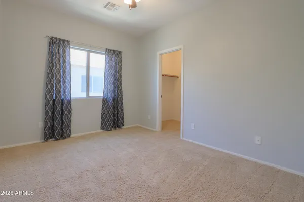 a view of an empty walk in closet