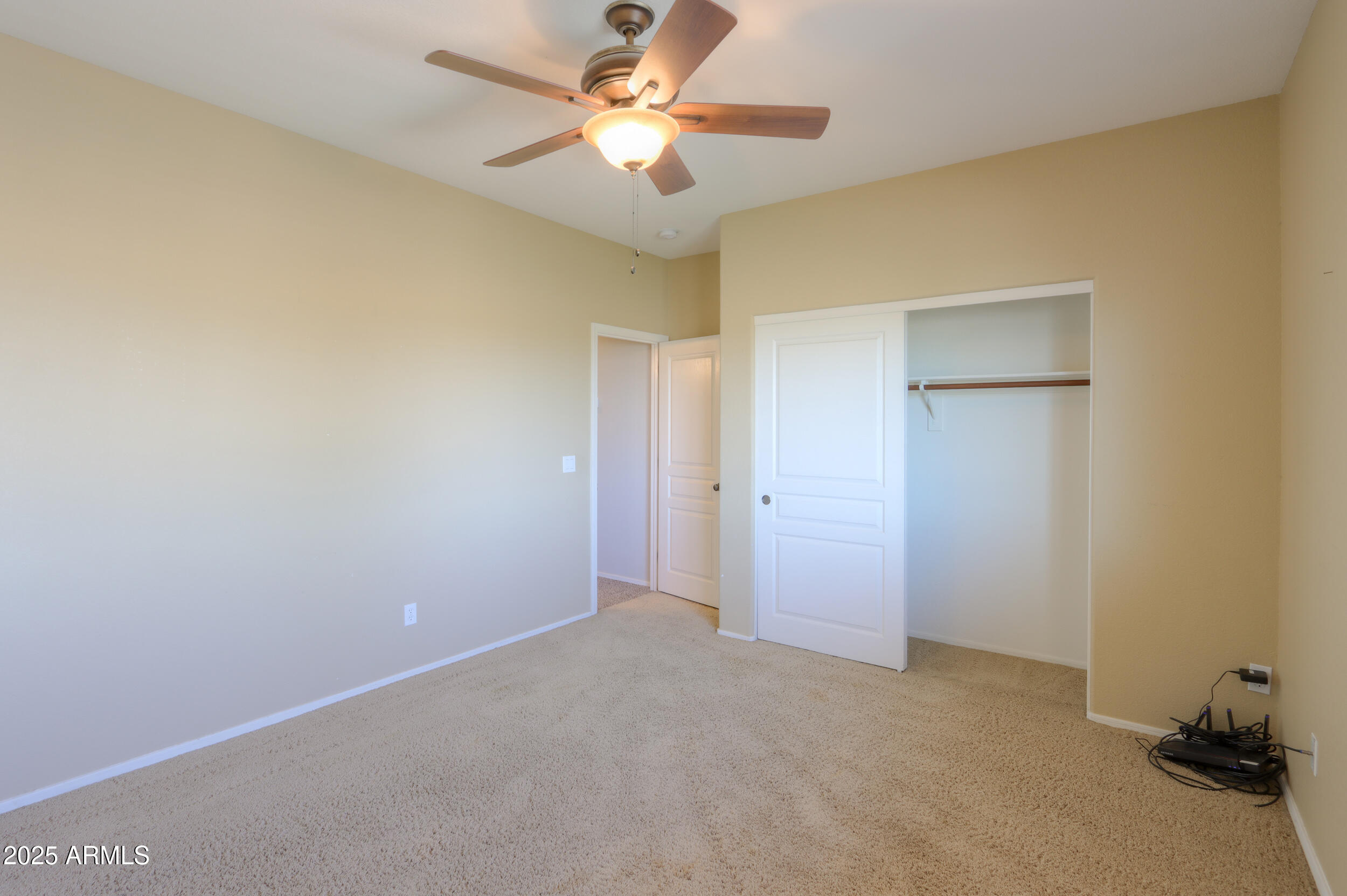 44254 Adobe Circle Maricopa, AZ 85139 - Photo 36 of 71 a view of a room with a ceiling fan and a fan