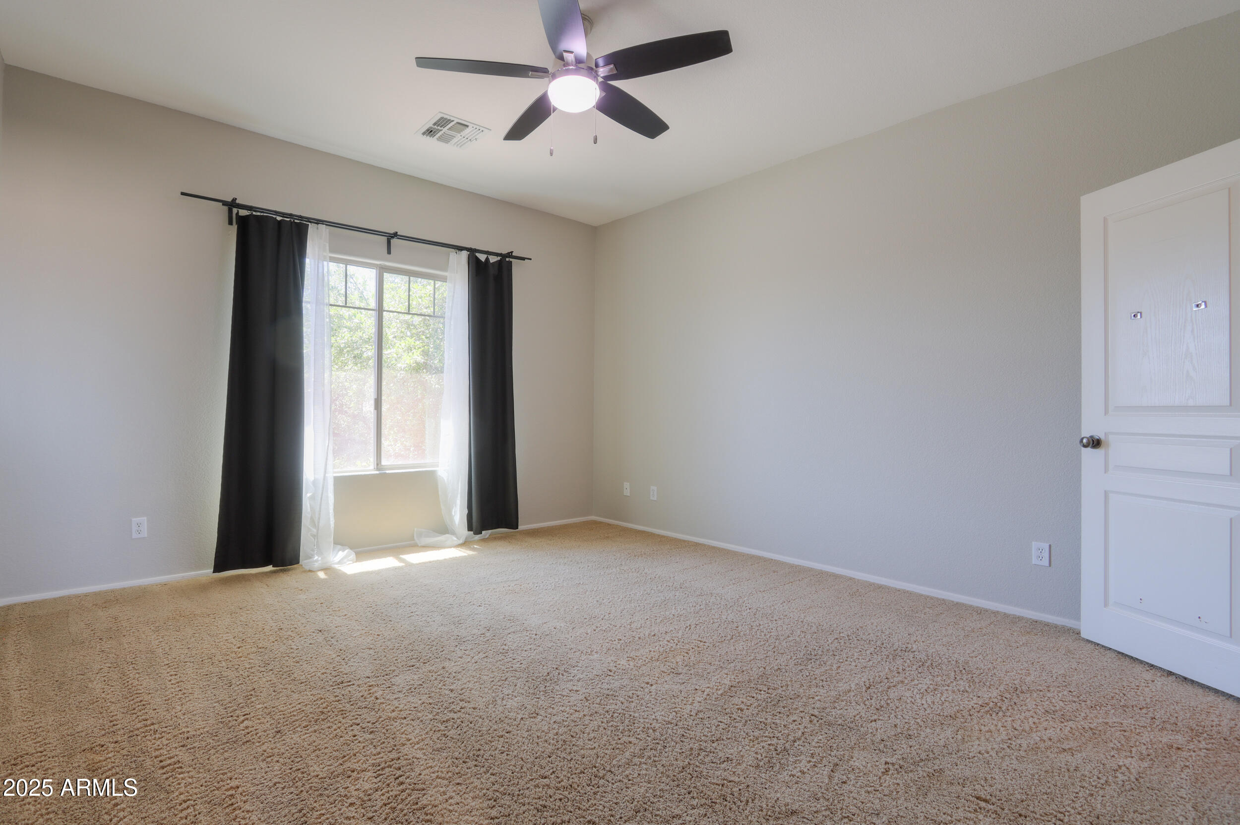 44254 Adobe Circle Maricopa, AZ 85139 - Photo 38 of 71 a view of an empty room with a window