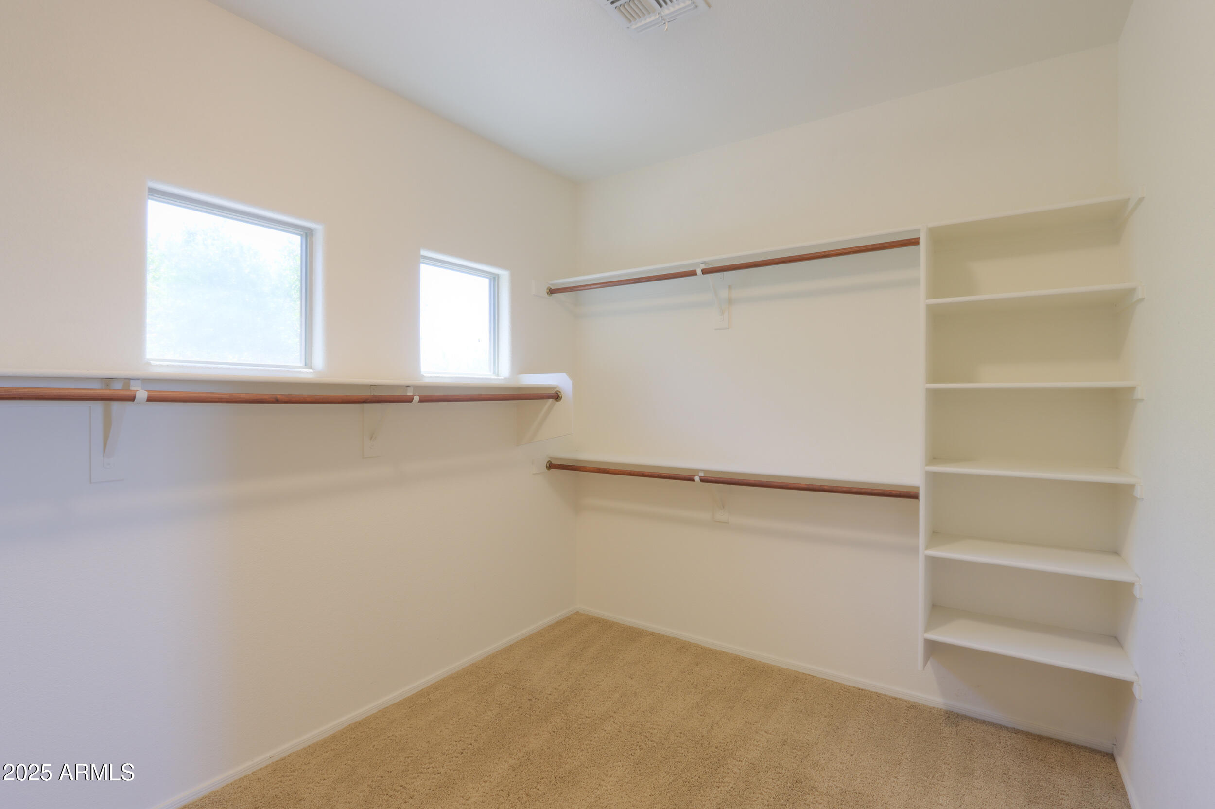 44254 Adobe Circle Maricopa, AZ 85139 - Photo 49 of 71 a view of an empty walk in closet