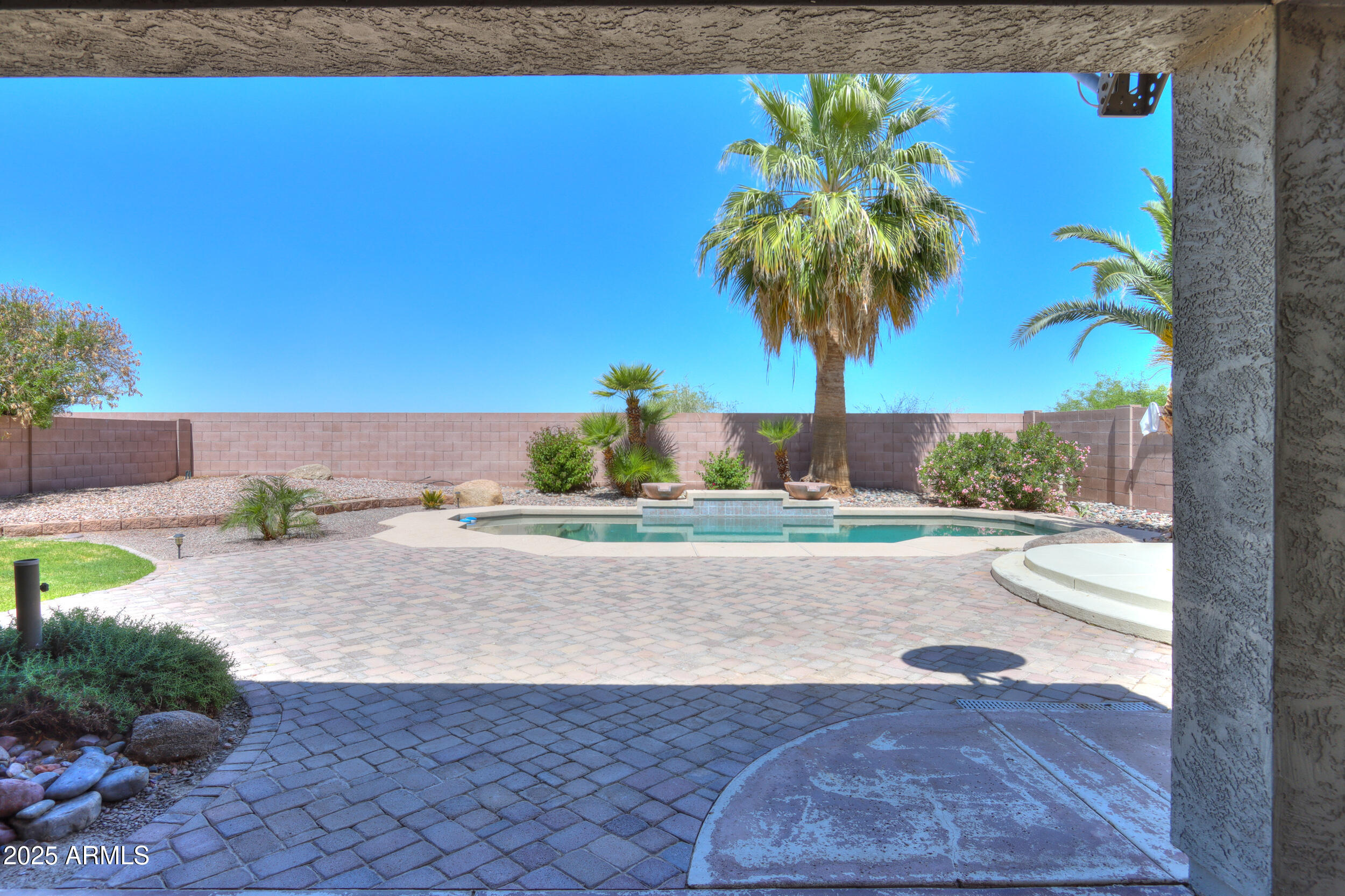 44254 Adobe Circle Maricopa, AZ 85139 - Photo 52 of 71 a view of a swimming pool and a yard